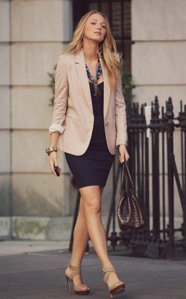 Khaki blazer with a black fitted mini skirt