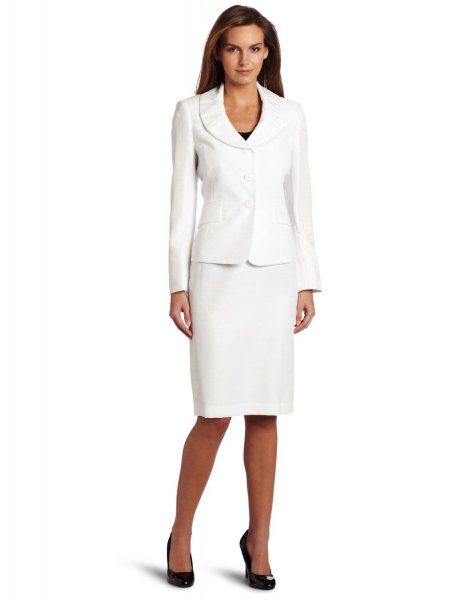 white suite jacket with a knee length straight dress and black heels