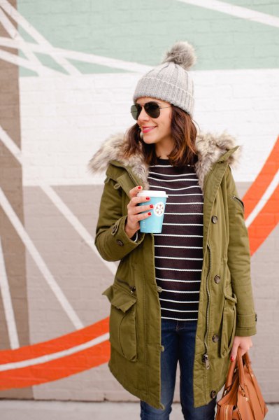 Camel lined parka coat with a black and white striped t-shirt