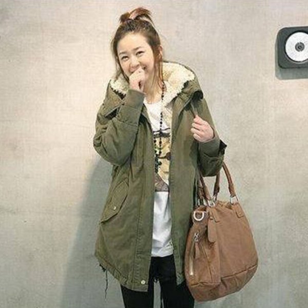green long parka coat with white printed t-shirt