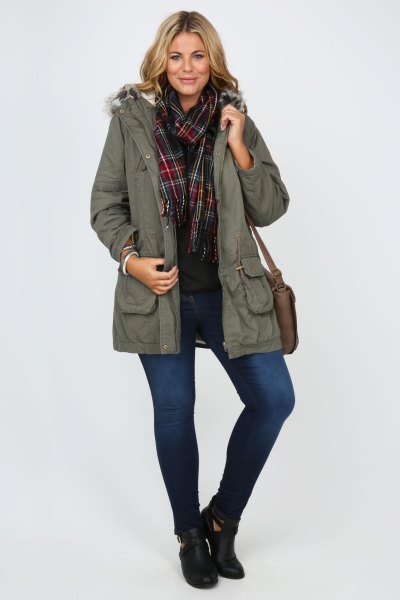 Parka coat with gray fur, black shirt and plaid scarf