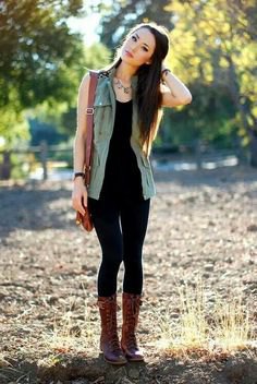 black tank top with matching skinny jeans and mid-calf lace-up boots