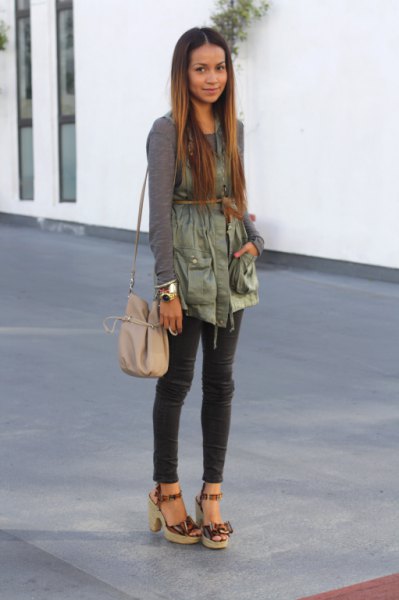 green long-sleeved t-shirt with green belted military vest