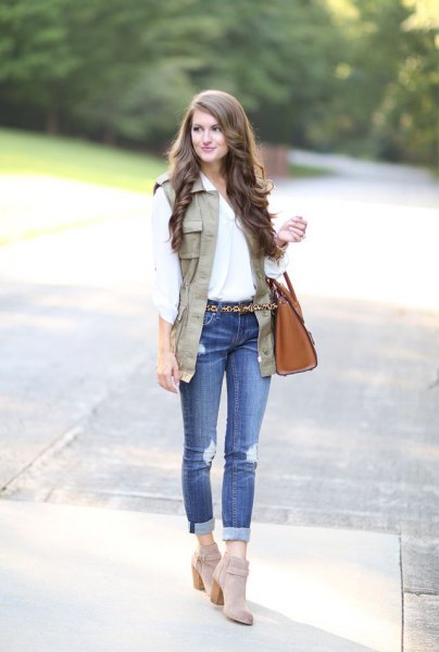 white blouse with tan waistcoat and gray suede boots