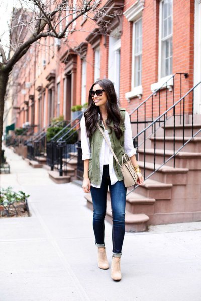 white chiffon blouse with olive green waistcoat and light pink leather shoulder bag