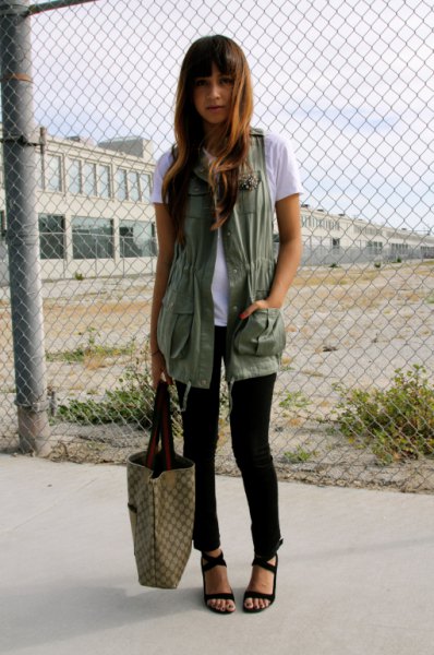 white t-shirt with long military vest and black sandals