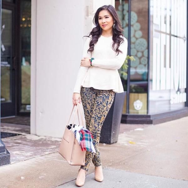 white peplum knit sweater with pink and blue tribal print drainpipe pants