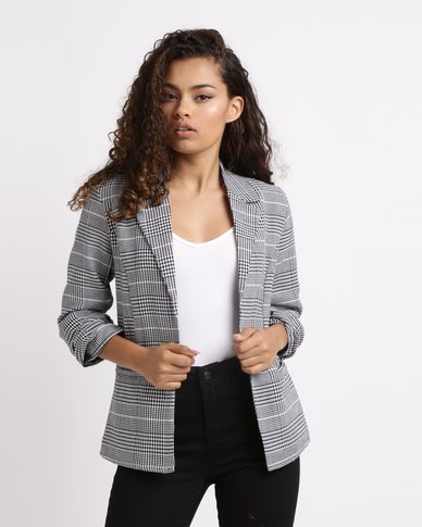 Checked blazer with white tank top and black high rise jeans