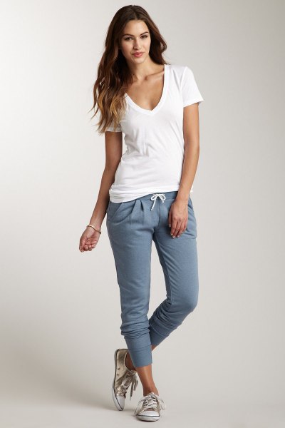 white plunging v-neck t-shirt and gray sweatpants