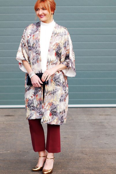 Flora printed long cape with red bell bottoms and bronze heels