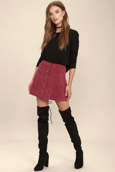 black fitted crew neck sweater with burgundy corduroy mini skirt