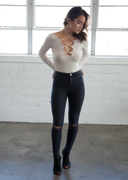 white ribbed skinny fit criss cross sweater black jeans