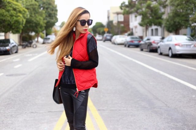 red quilted vest with all black outfit