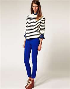 black and white striped knit sweater with royal blue leggings