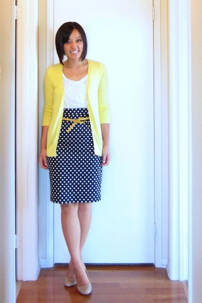 yellow cardigan with white vest and polka dot midi skirt