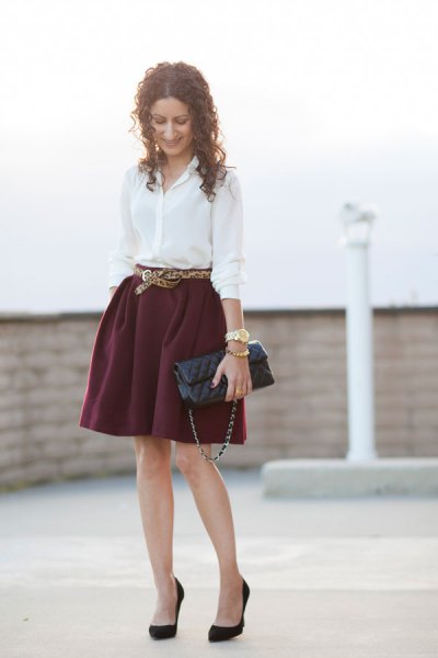 White button down shirt and belted mini skirt