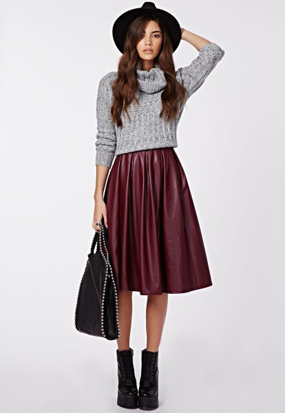 Short knit sweater with gray cowl neckline and flared midi silk skirt