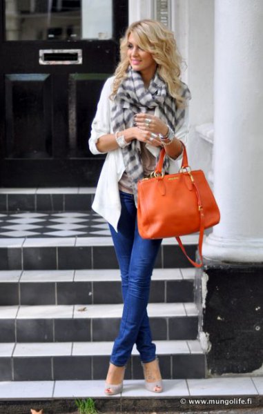 white casual blazer with gray plaid scarf and orange leather handbag