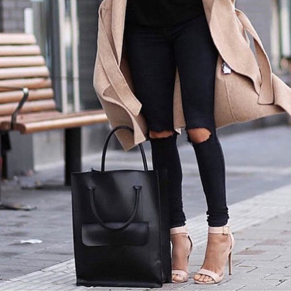 Blush pink wool coat with black ripped knee jeans