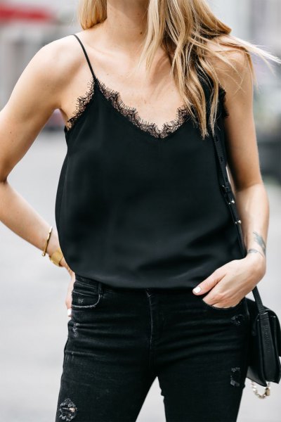 Skinny jeans paired with a black lace shirt