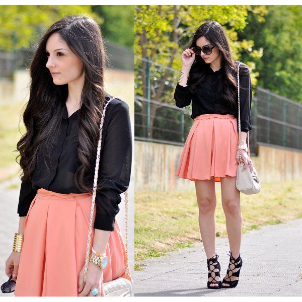 black button down shirt and light orange mini skirt