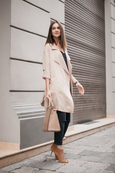 beige long trench coat with half sleeves and black waistcoat