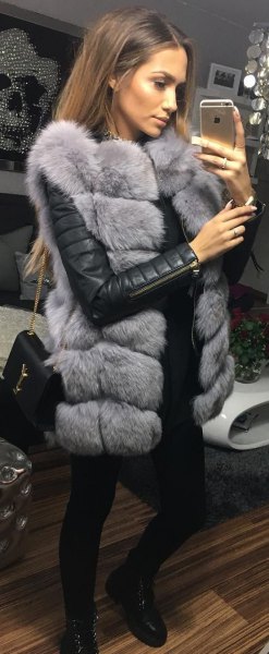 gray faux fur sleeveless bubble coat with black leather jacket