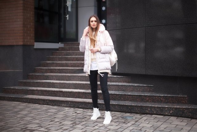 white long bubble coat with black skinny jeans and high top sneakers