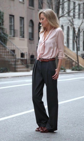 Light pink blouse in front with black wide leg pants