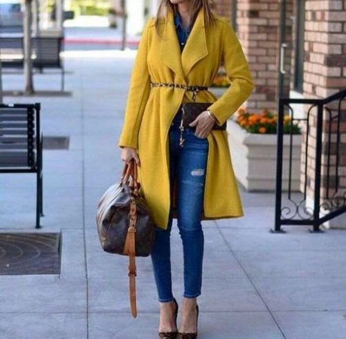 Yellow longliner coat with fleece belt and skinny jeans with blue ankles