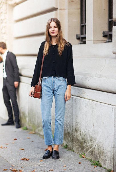 black sweater with blue jeans and leather shoes