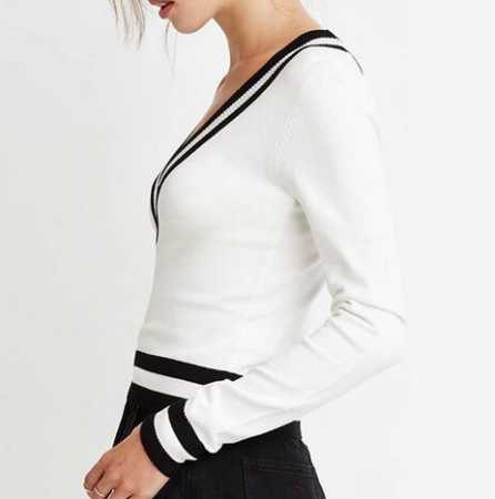 white sweater with black mini skirt