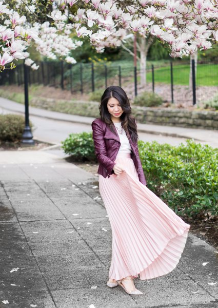 black leather jacket with light pink pleated maxi skirt