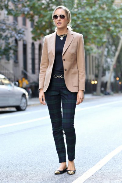 Camel blazer with black t-shirt and dark gray plaid trousers