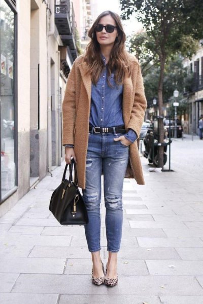long camel wool jacket with blue chambray shirt and ripped jeans