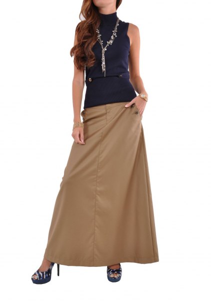 sleeveless top with dark blue mock neck and long khaki skirt