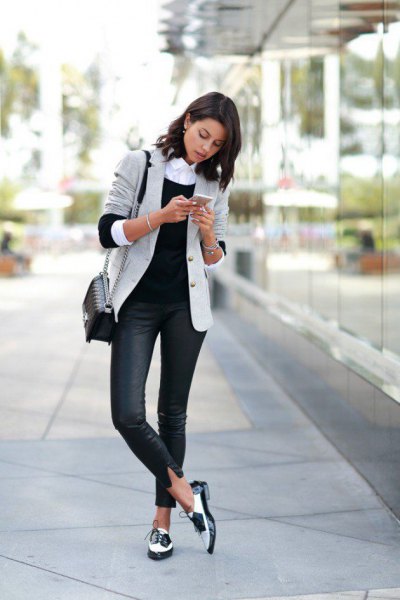 light gray blazer with dark blue skinny jeans and white goat shoes