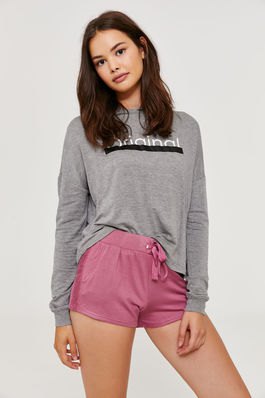 gray graphic sweatshirt with blush pink high waist shorts