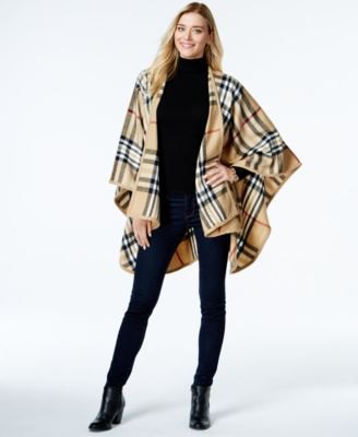 Crepe turtleneck and black check poncho with a slim fit