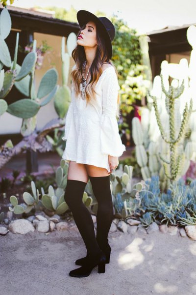 white long-sleeved shirt dress with tights and ankle boots