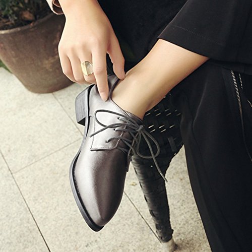 dark leather high heel shoes with black straight leg chinos