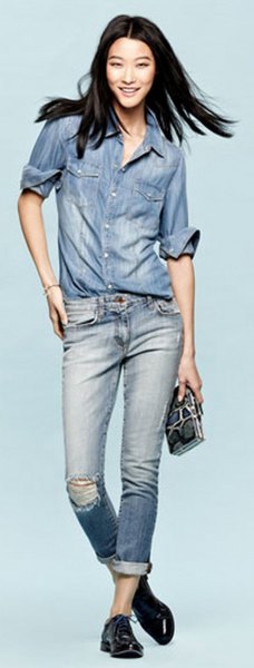 Chambray shirt with blue ripped jeans with cuffs