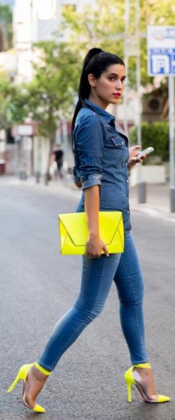 dark blue chambray shirt with buttons, yellow clutch and matching high heels