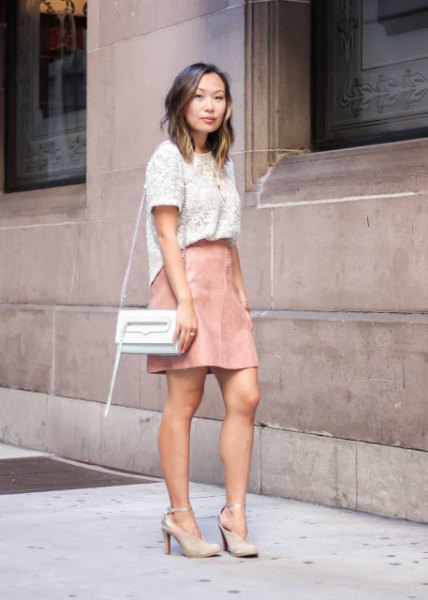 short sleeve white lace top with light pink leather mini skirt