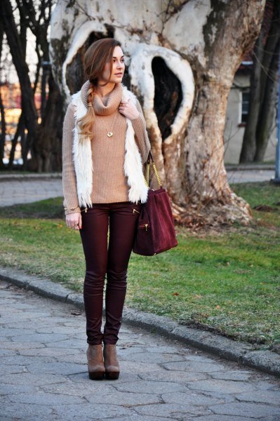black coated jeans with red turtleneck and white vest