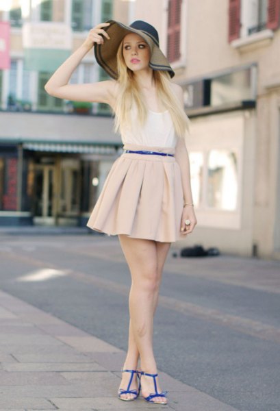white vest top and light pink pleated mini skirt
