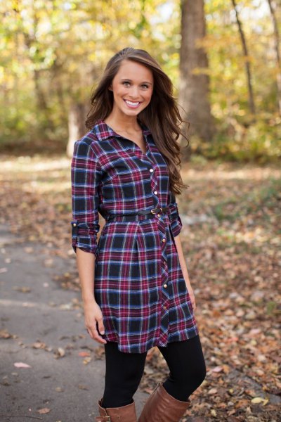 Dark blue plaid shirt dress with black leggings and leather boots