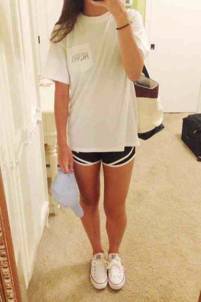white oversized t-shirt with black running shorts