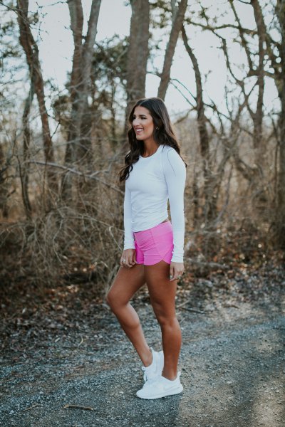 white long sleeve fitted t-shirt with gray high waisted mini running shorts