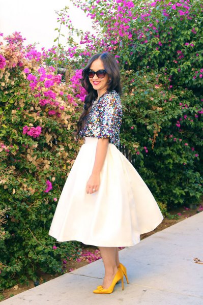 silver top with half sleeves and white midi skirt
